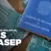 carteira de trabalho sobre notas de 100 reais representa o abono salarial PIS/PASEP.