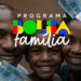 Imagem promocional do Bolsa Família e Auxílio Gás, com a logo do programa e uma família sorrindo ao fundo, acompanhada por notas de 100 reais.