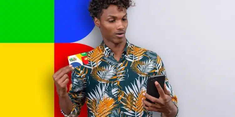 Homem segurando um cartão do Bolsa Família enquanto olha para o celular, com fundo colorido em amarelo, verde, azul e vermelho.