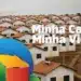 Casas com telhados laranja alinhadas e logo do Minha Casa, Minha Vida em destaque