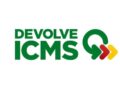 Logotipo do programa Devolve ICMS com setas nas cores verde, vermelho e amarelo.